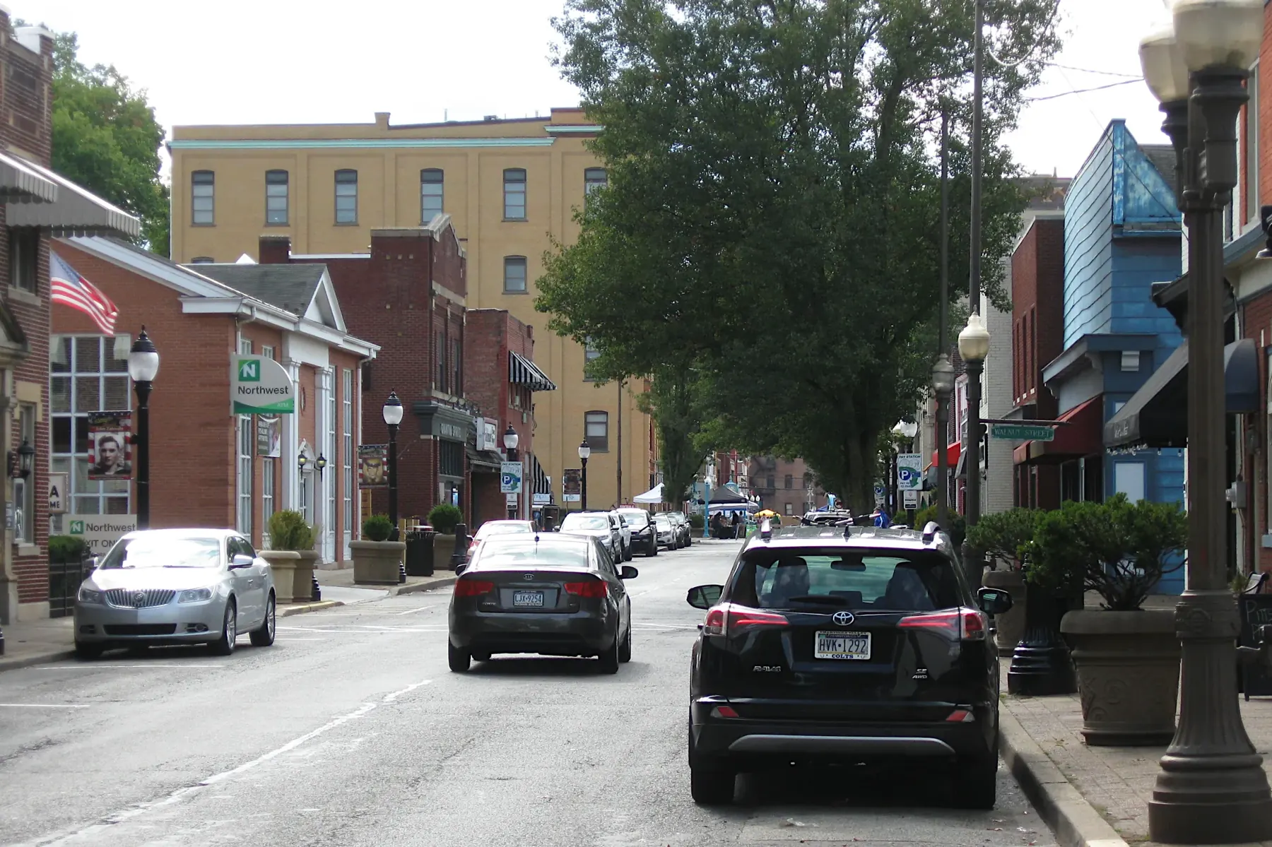 Main Street in Carnegie, Pennsylvania, with brick storefronts and parked cars