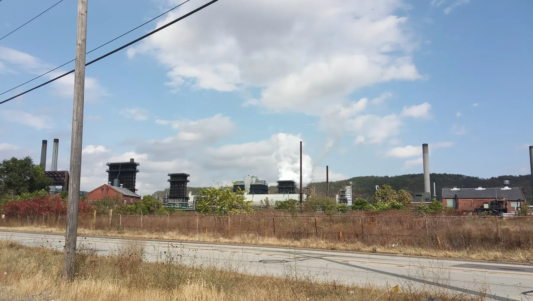 Chimneys of the Clairton coke works rising above open ground on the Mon Valley skyline