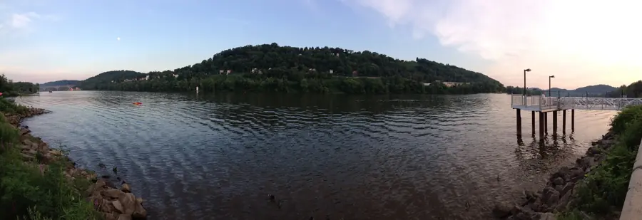 The Allegheny River at O'Hara Township with wooded hills on the far bank