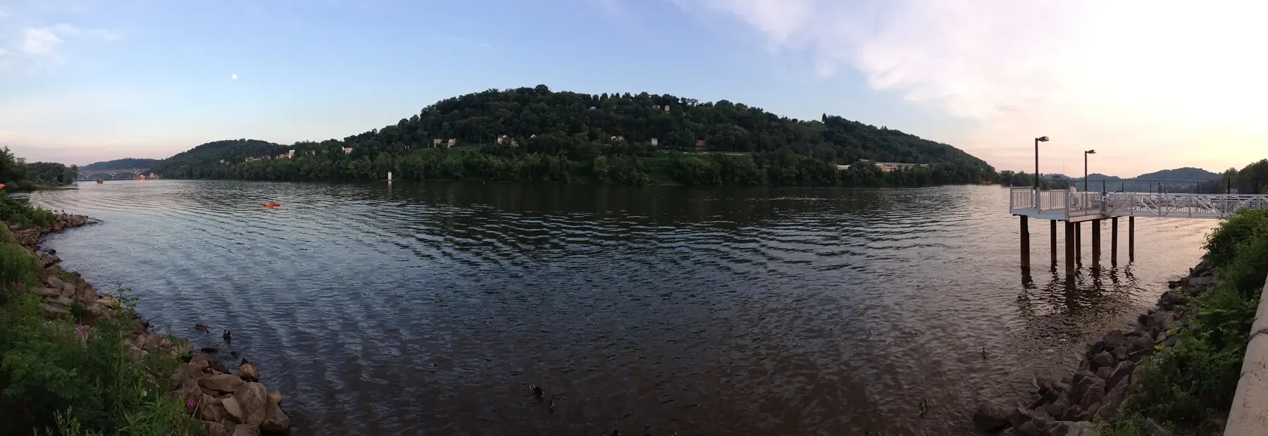 The Allegheny River at O'Hara Township with wooded hills on the far bank