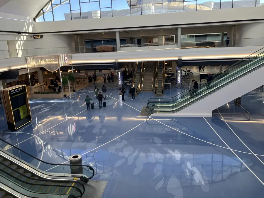 The bright, glossy-floored core of the 2026 terminal at Pittsburgh International Airport