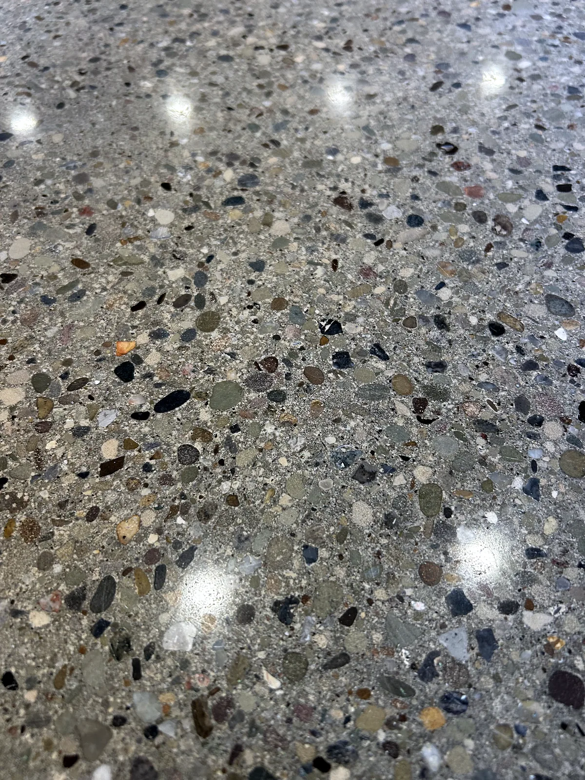 Very close view of a ground and polished concrete floor with exposed stone aggregate, Pittsburgh area.